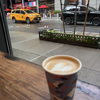 Think Coffee - Seated at the window bench watching the rain - Coffee & Tea Near Me - New York, New York Think Coffee - Seated at the window bench watching the rain - Coffee & Tea Near Me - New York, New York