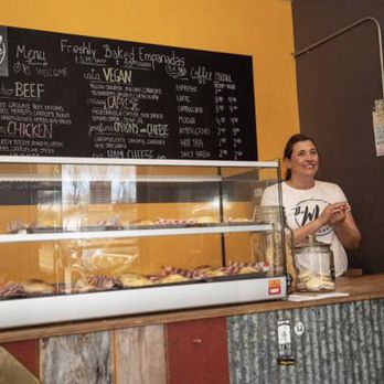 The Whole Empanada - a woman standing behind a counter - Empanadas Near Me - Basalt, Colorado