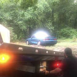 Winching the car out of sand in the rain and aligning it to the bed
