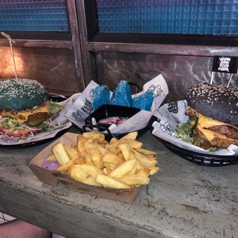 Vegan Junk Food Bar - (left) Daddy Mc Chicken, (top center) Unicorn Bread, (right) Notorious Sumo, (bottom center) Frites uit Zuyd with purple garlic sauce. - Vegan Near Me - Amsterdam, New Hampshire Vegan Junk Food Bar - (left) Daddy Mc Chicken, (top center) Unicorn Bread, (right) Notorious Sumo, (bottom center) Frites uit Zuyd with purple garlic sauce. - Vegan Near Me - Amsterdam, New Hampshire