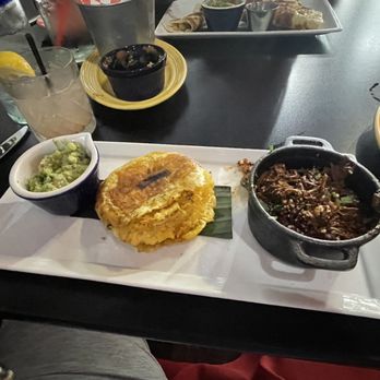 Fuego Latino Gastropub - Chipotle braised lamb barbacoa with tostones. - Latin American Near Me - Georgetown, Texas Fuego Latino Gastropub - Chipotle braised lamb barbacoa with tostones. - Latin American Near Me - Georgetown, Texas