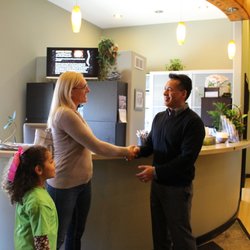 Natural Choice Chiropractic - Dr. Andres greeting patients.
