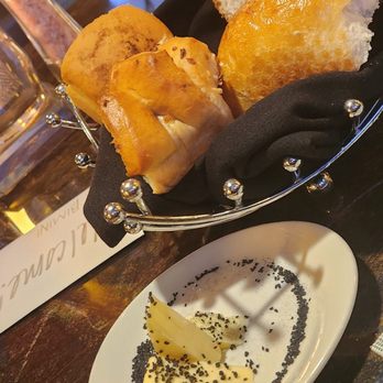 Bimini Steakhouse - Bread that is served once you're seated. Butter is sprinkled with a black salt. - Steakhouses Near Me - Reno, Nevada