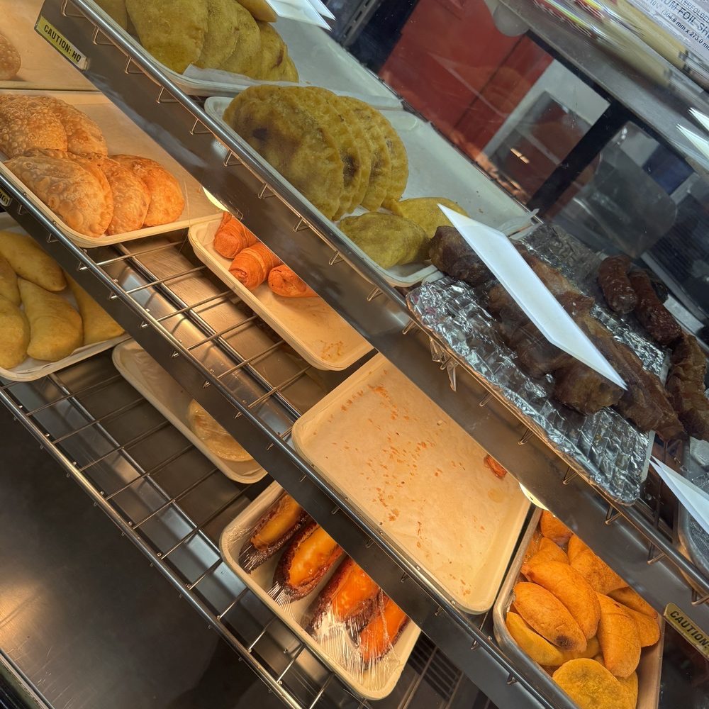Punto Rojo - a variety of pastries in a display case - Colombian Near Me - Freeport, New York Punto Rojo - a variety of pastries in a display case - Colombian Near Me - Freeport, New York