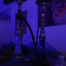 a hookah lounge with a blue light a hookah lounge with a blue light