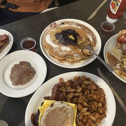 Champane’s Grille - Lemon poppyseed pancake with blueberry compote, kids Mickey pancake, the McCurry breakfast sandwich and side of bacon and sausage.