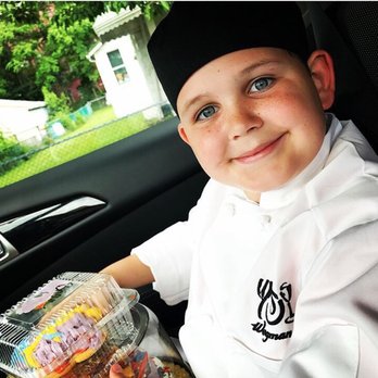 Wegmans - a young boy in a car with a tray of donuts - Grocery Near Me - Wilkes Barre, Pennsylvania Wegmans - a young boy in a car with a tray of donuts - Grocery Near Me - Wilkes Barre, Pennsylvania
