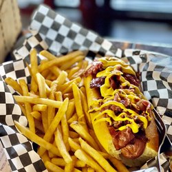 Bombdiggity Dogs Burgers & Brew - Pastrami Dog- all beef, comes with a pickle inside and mustard on top. Bun was similar to a French roll, complimented the dog well