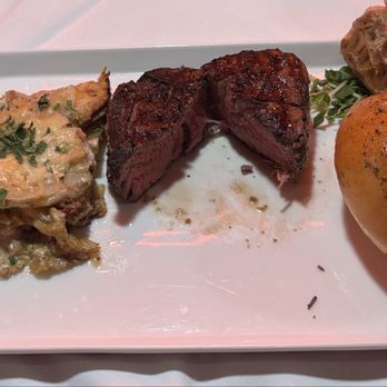 Red PrimeSteak - 7oz filet, Horseradish Potato Gratin, served with a baked garlic clove and a skillet roll - Steakhouses Near Me - Oklahoma City, Oklahoma Red PrimeSteak - 7oz filet, Horseradish Potato Gratin, served with a baked garlic clove and a skillet roll - Steakhouses Near Me - Oklahoma City, Oklahoma