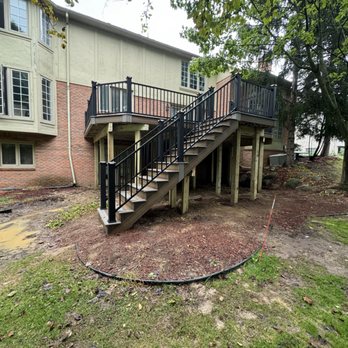 Decks Unlimited - Trex walk out deck with staircase and Trex signature railing - Decks & Railing Near Me - Flat Rock, Michigan Decks Unlimited - Trex walk out deck with staircase and Trex signature railing - Decks & Railing Near Me - Flat Rock, Michigan