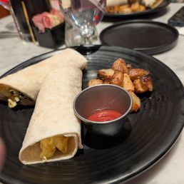Breakfast wrap and their wonderful potatoes.