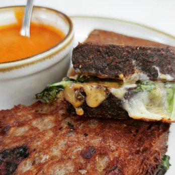 The Speckled Egg PGH - Grilled cheese on whole wheat sourdough with caramelized onions and arugula, and a cup of tomato bisque. - Breakfast & Brunch Near Me - Pittsburgh, Pennsylvania