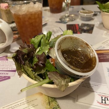 Wildflower Cafe - Salad served in a bowl barley larger than the plastic dressing cup. The salad itself was just a pinch of spring mix with some parm. - New American Near Me - Mentone, Alabama