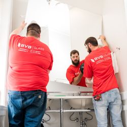 Bacon & Van Buskirk Glass - BVB installation team installing a new vanity mirror.