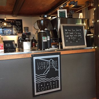 Java Jahn - a coffee shop counter with a sign that says, - Coffee & Tea Near Me - Seattle, Washington