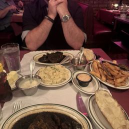 Steaks, mashed potatoes, baked potatoes, fries