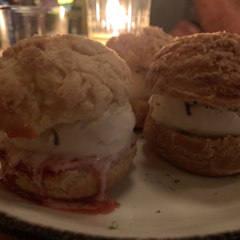 Nancy's Hustle - profiteroles stuffed with soft jasmine stracchiatella ice cream, strawberry sauce and lime - New American Near Me - Houston, Texas Nancy's Hustle - profiteroles stuffed with soft jasmine stracchiatella ice cream, strawberry sauce and lime - New American Near Me - Houston, Texas