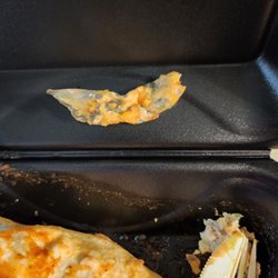 El Patio Mexican Restaurant - Plastic wrapper in burrito.