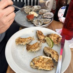 Oysters on Happy Hour, raw and roasted Oysters on Happy Hour, raw and roasted