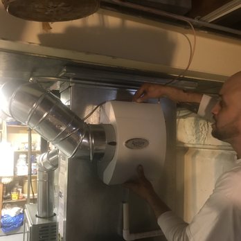 Maxson Heating & Air Conditioning - Technician, Alex, demonstrating how to clean humidifier.  Thoroughly explained all maintenance needed with prescribed date. - Heating & Air Conditioning/HVAC Near Me - Wheaton, Illinois