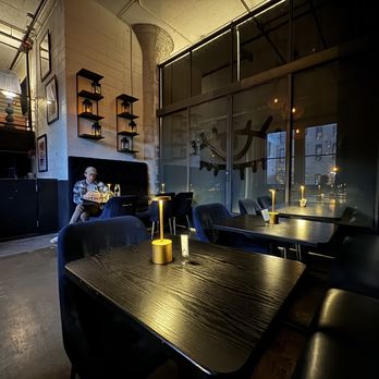Cobble Social House - a man sitting at a table - Cocktail Bars Near Me - Minneapolis, Minnesota Cobble Social House - a man sitting at a table - Cocktail Bars Near Me - Minneapolis, Minnesota