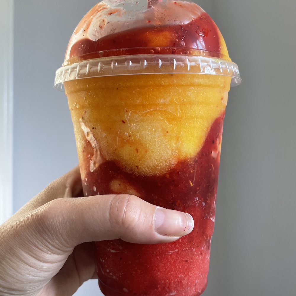 Michoacana Delights - a hand holding a cup of fruit smoothie - Ice Cream & Frozen Yogurt Near Me - Los Angeles, California