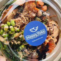 Happy Poke - Blue fin tuna, fresh crab, salmon, veggies, salad, kimchi, roe, rice. So many wonderful flavors!