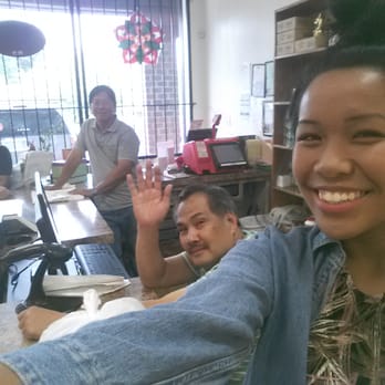 Manila Market - a man and a woman sitting at a table with a laptop in front of them - Grocery Near Me - Beltsville, Maryland Manila Market - a man and a woman sitting at a table with a laptop in front of them - Grocery Near Me - Beltsville, Maryland