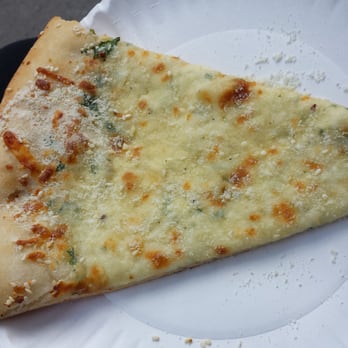 Pizza Chez Dany - a slice of pizza on a paper plate - Pizza Near Me - Montreal, Quebec Pizza Chez Dany - a slice of pizza on a paper plate - Pizza Near Me - Montreal, Quebec