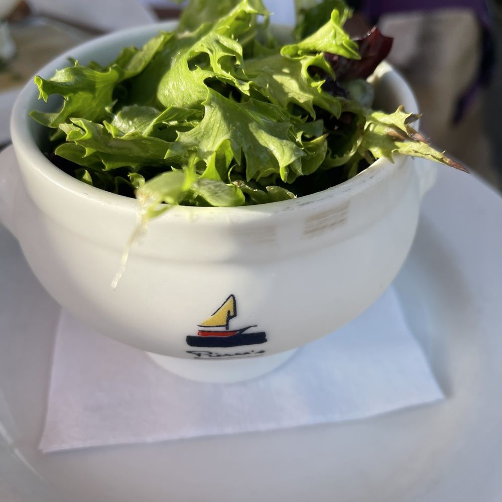 Pierre's - a bowl of lettuce on a plate - French Near Me - Bridgehampton, New York Pierre's - a bowl of lettuce on a plate - French Near Me - Bridgehampton, New York