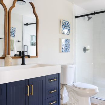 Foreverhome Properties - a bathroom with blue cabinets and a white toilet - Architects Near Me - Livermore, California Foreverhome Properties - a bathroom with blue cabinets and a white toilet - Architects Near Me - Livermore, California