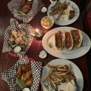 Taps Bar and Grill - Banging shrimp tacos side of Gouda Mac. Wings, Spicy Cajun, garlic Parmesan ranch, and honey barb! Gyro wrap made with lamb and beef! - Sports Bars Near Me - Jacksonville, Florida