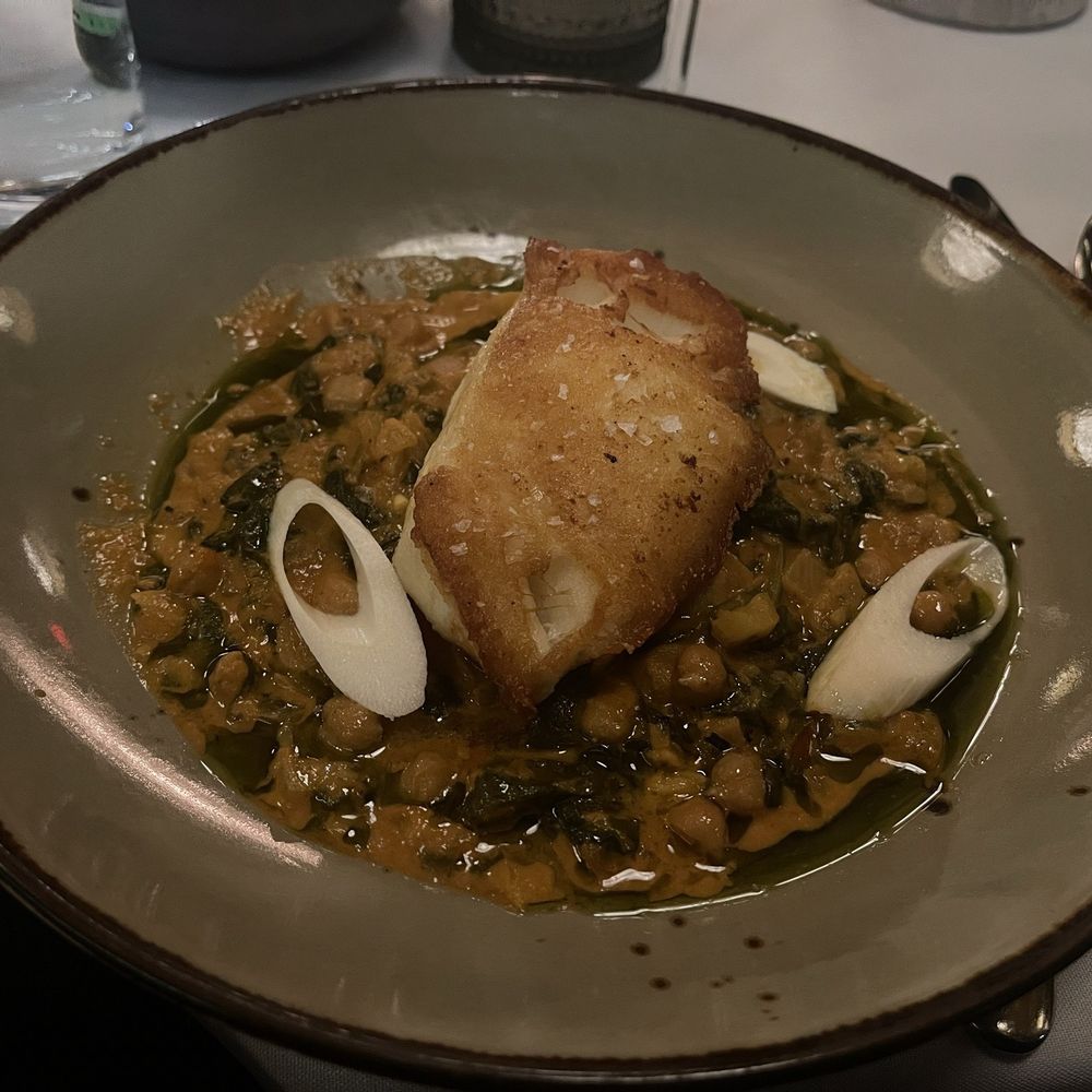 The Tasting Room - Chilean Seabass over tomato curry chickpeas and heart of palm. - New American Near Me - Frederick, Maryland The Tasting Room - Chilean Seabass over tomato curry chickpeas and heart of palm. - New American Near Me - Frederick, Maryland