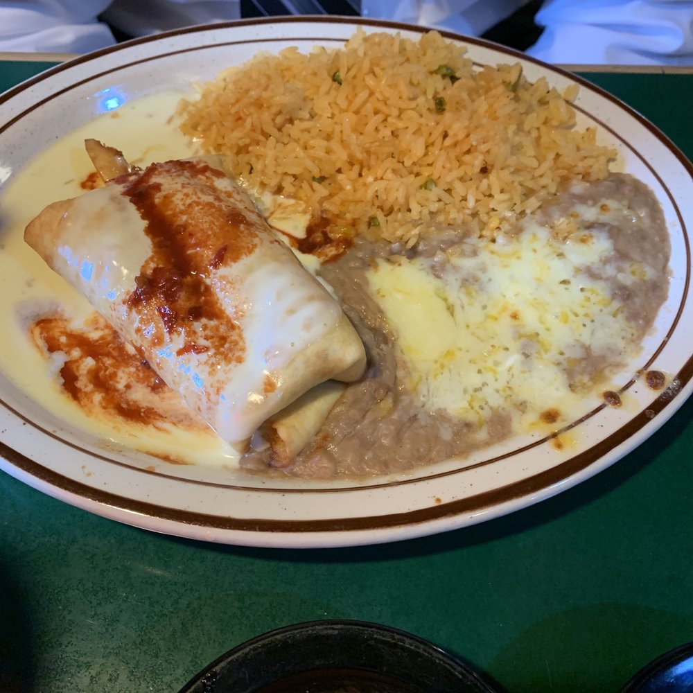 Fiesta Mexicana Grill - Chicken chimichanga with yellow rice and beans. My hubby's favorite. - Mexican Near Me - Concord, North Carolina Fiesta Mexicana Grill - Chicken chimichanga with yellow rice and beans. My hubby's favorite. - Mexican Near Me - Concord, North Carolina