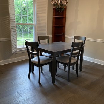 TN Floors - a dining room with a table and chairs - Flooring Near Me