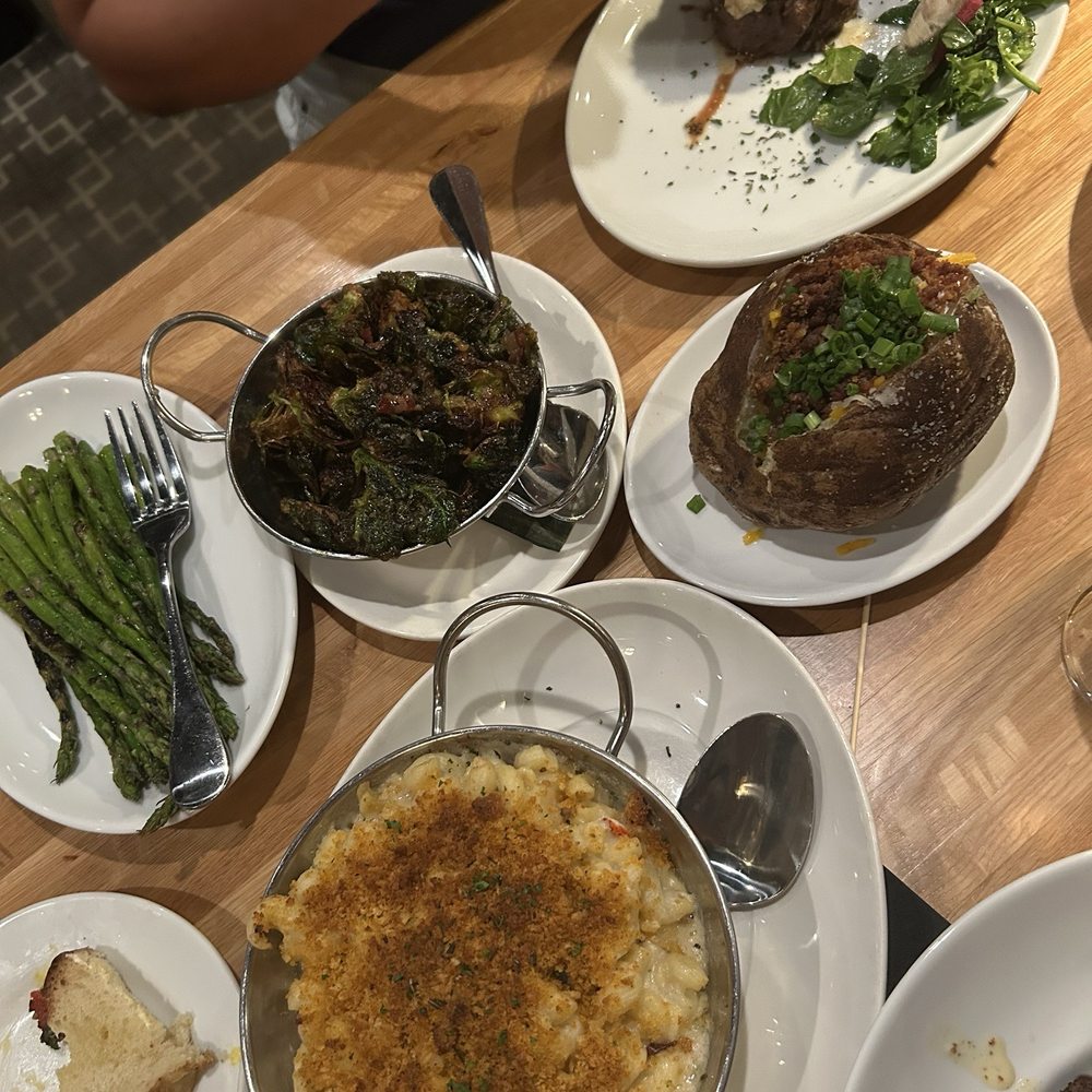ChopHouse Thirteen - Slice of focaccia, asparagus, Brussel sprouts, lobster Mac, baked potato, filet with blue cheese sauce - Bars Near Me - Jacksonville, Florida