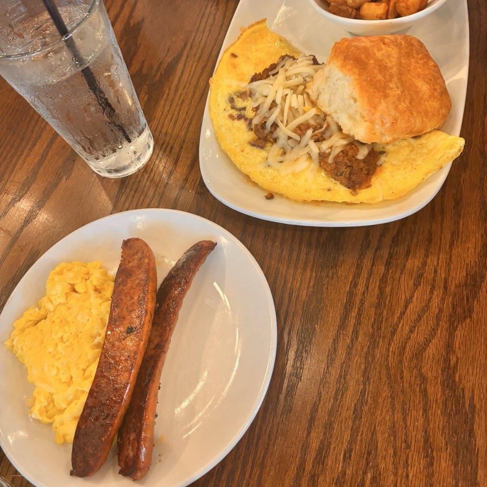 Another Broken Egg Cafe - Scrambled eggs and andouille sausage, bacon omelette with chorizo and cheese. Side of potatoes and biscuit. - Breakfast & Brunch Near Me - McAllen, Texas Another Broken Egg Cafe - Scrambled eggs and andouille sausage, bacon omelette with chorizo and cheese. Side of potatoes and biscuit. - Breakfast & Brunch Near Me - McAllen, Texas