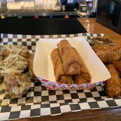 The Wing Boss - 6 piece Parmesan LP, 3 boudin rolls, 6 piece Zesty Honey Garlic. !