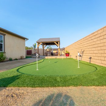 Beautiful Artificial Grass Putting Green Fire Pit Pergola And