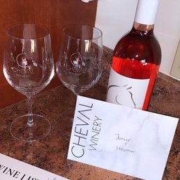 a bottle of wine and two wine glasses