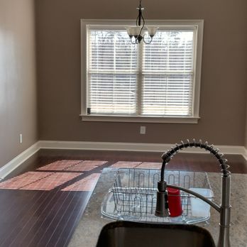 T's Painting & Lawn Service - a kitchen with a sink and window - Lawn Services Near Me T's Painting & Lawn Service - a kitchen with a sink and window - Lawn Services Near Me