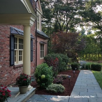 Innovative Landscaping - a walkway leading to a house - Lawn Services Near Me - Acton, Massachusetts