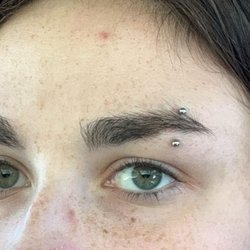 The Edge - Nostril and eyebrow piercing