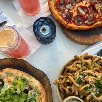 Lyla - Truffle fries, arugula/fig and truffle pepperoni pizza. Peach Mocktail. - Italian Near Me - Dallas, Texas Lyla - Truffle fries, arugula/fig and truffle pepperoni pizza. Peach Mocktail. - Italian Near Me - Dallas, Texas