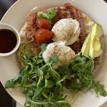 The Leaning Maple - Breakfast Waffle - 2 poached eggs, avocado, bacon, arugula salad, roasted cherry tomatoes in oil on top of a GF waffle & side of syrup. - Coffee & Tea Near Me - Olympia, Washington