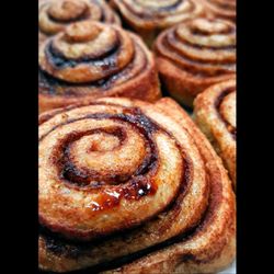 Old Mission Bakery - Multigrain cinnamon rolls served with cream cheese frosting. Made with local ingredients!