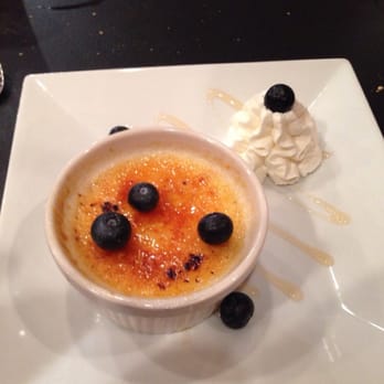 Osteria 166 - The Key Lime Creme brûlée with blueberry compote and whipped cream. - Italian Near Me - Buffalo, New York Osteria 166 - The Key Lime Creme brûlée with blueberry compote and whipped cream. - Italian Near Me - Buffalo, New York