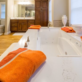 Advanced Construction - a bathtub with orange towels - General Contractors Near Me - Mystic, Connecticut Advanced Construction - a bathtub with orange towels - General Contractors Near Me - Mystic, Connecticut