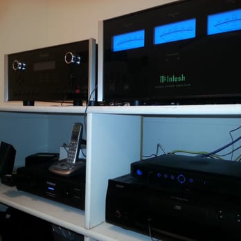Definitive Entertainment - McIntosh Equipment hidden in main laundry room closet. Using RTI for control. - Home Theatre Installation Near Me - Phoenix, Arizona