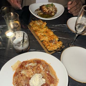 Saint Resto Lounge - Broken lasagna, trio Mac & cheese and parm lamb chops - Lounges Near Me - New York, New York